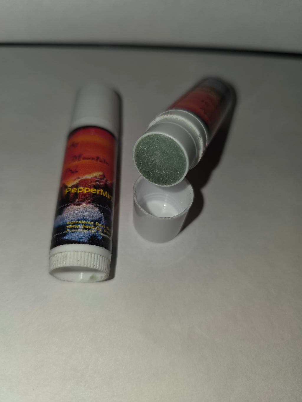 Peppermint Lip Balm tubes with one cap removed