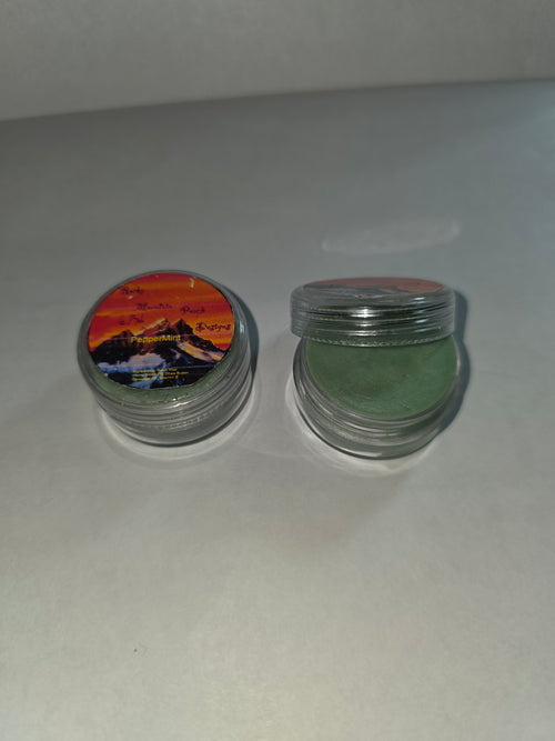 Peppermint Lip Balm canisters showing the balm with one lid removed