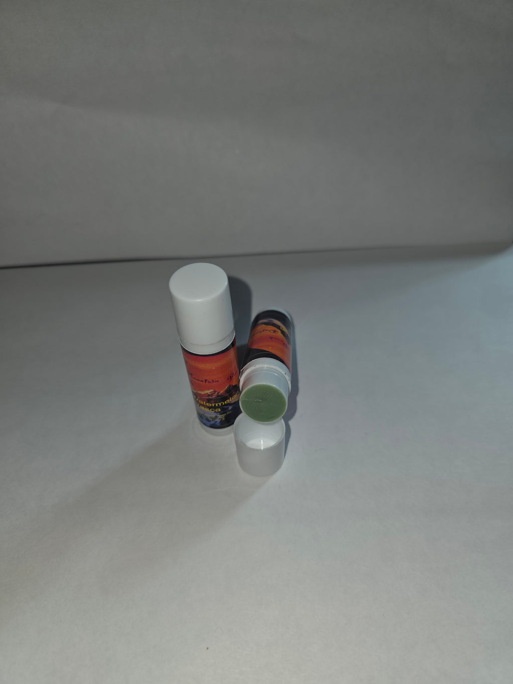 Watermelon Fresca Lip Balm twist tubes showing closed packaging and exposed balm