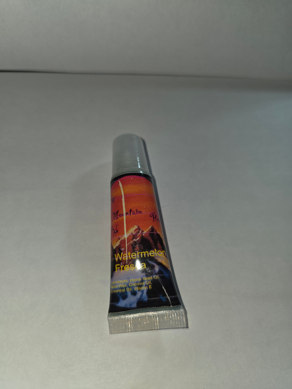 Watermelon Fresca Lip Balm squeeze tube with cap closed