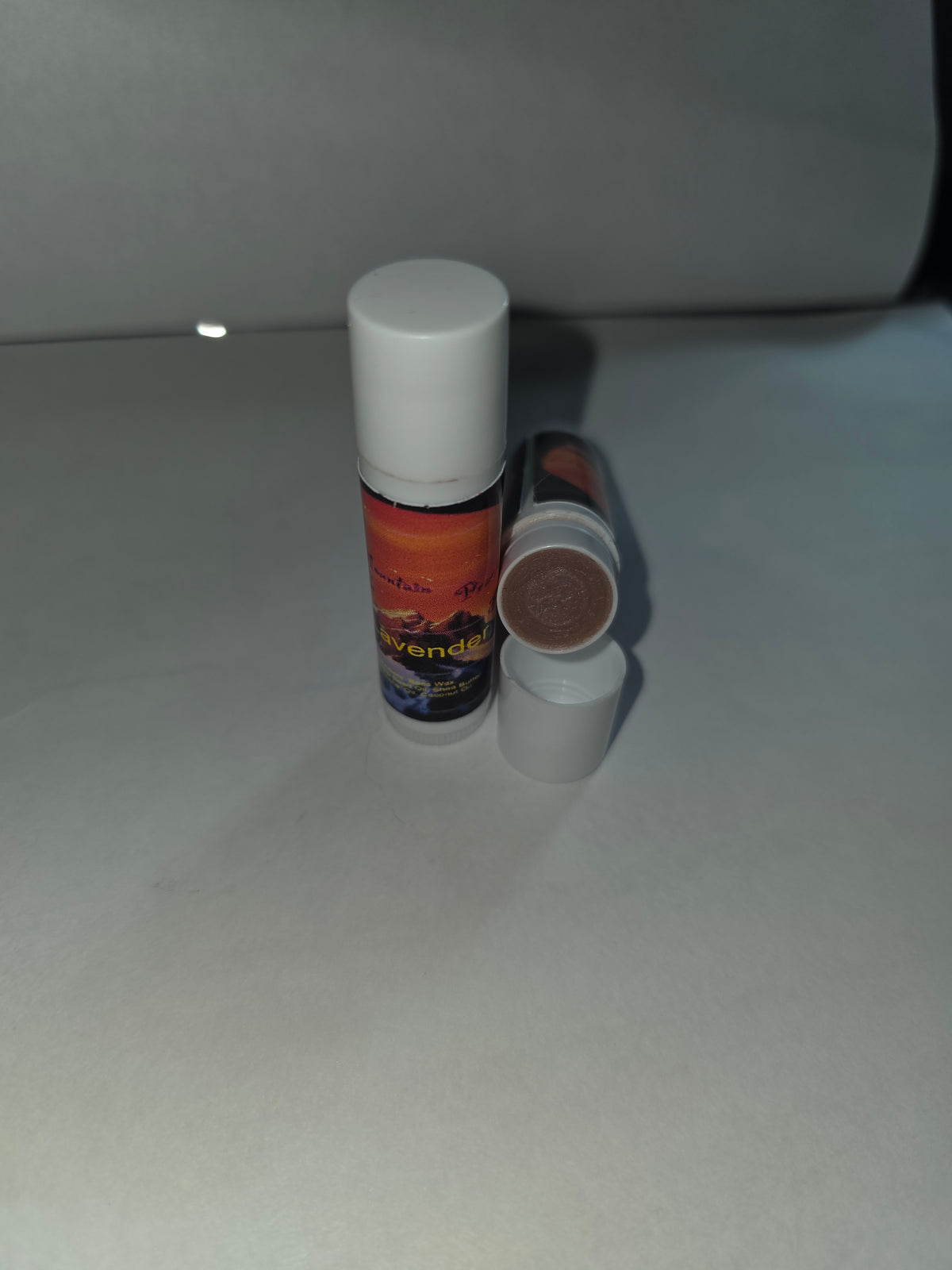 Lavender Lip Balm twist tubes showing capped and open packaging