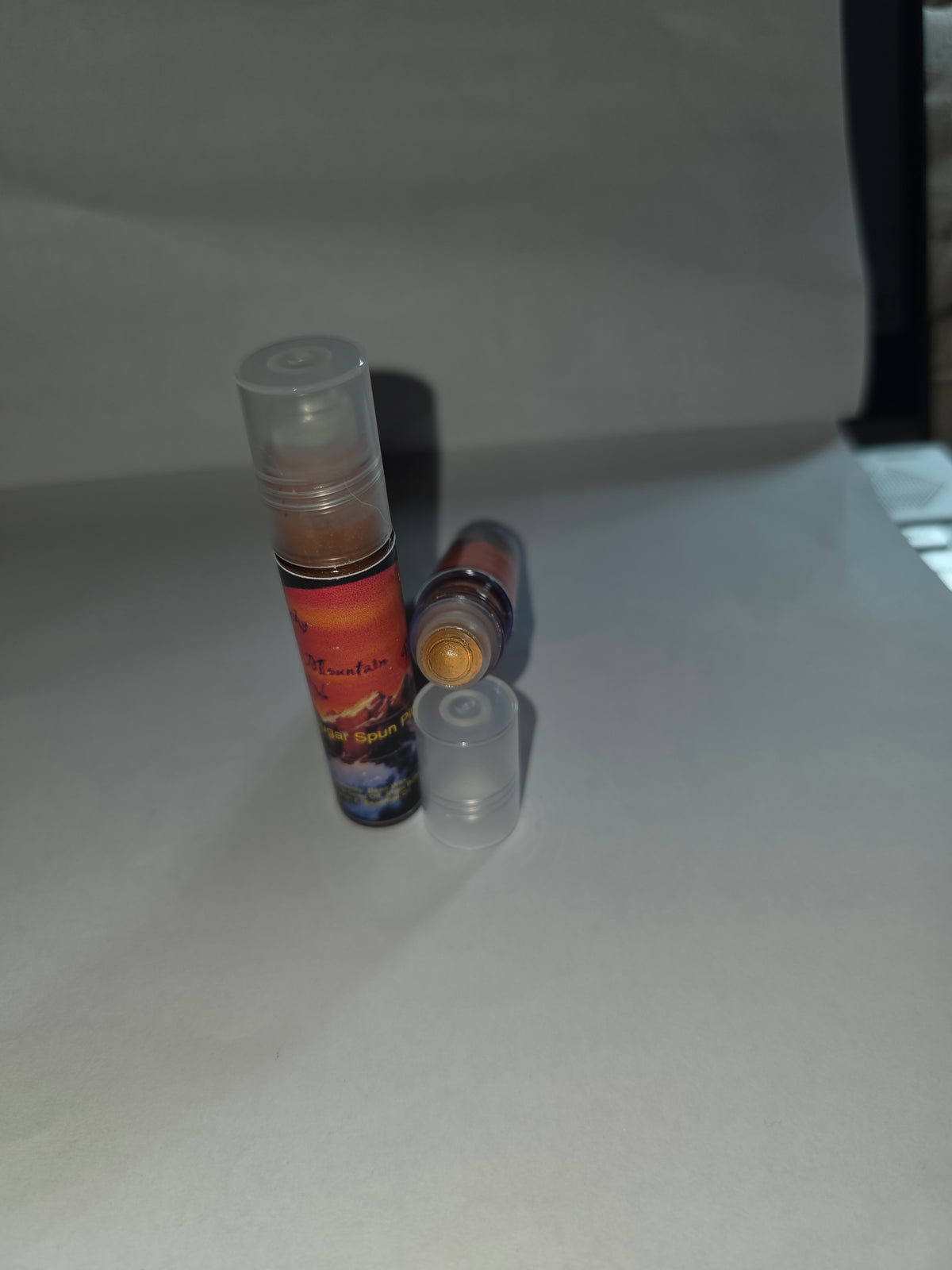 Sugar Spun Pineapple Lip Gloss showing capped and open packaging