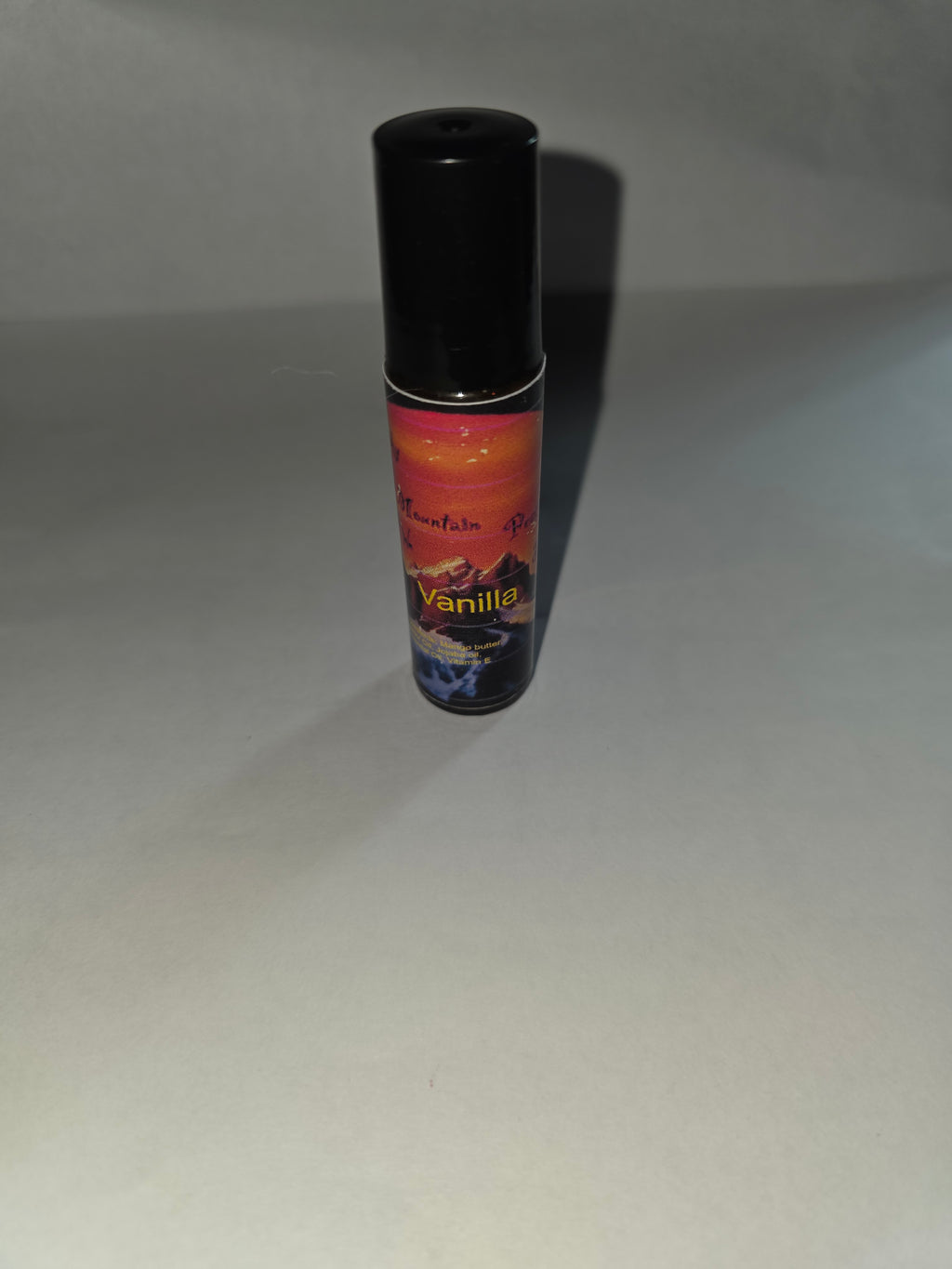 Vanilla Lip Gloss with black cap on