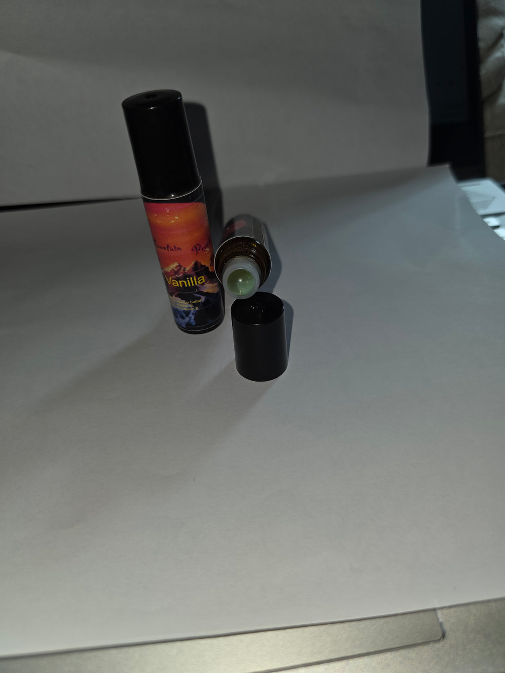 Vanilla Lip Gloss showing capped and open packaging