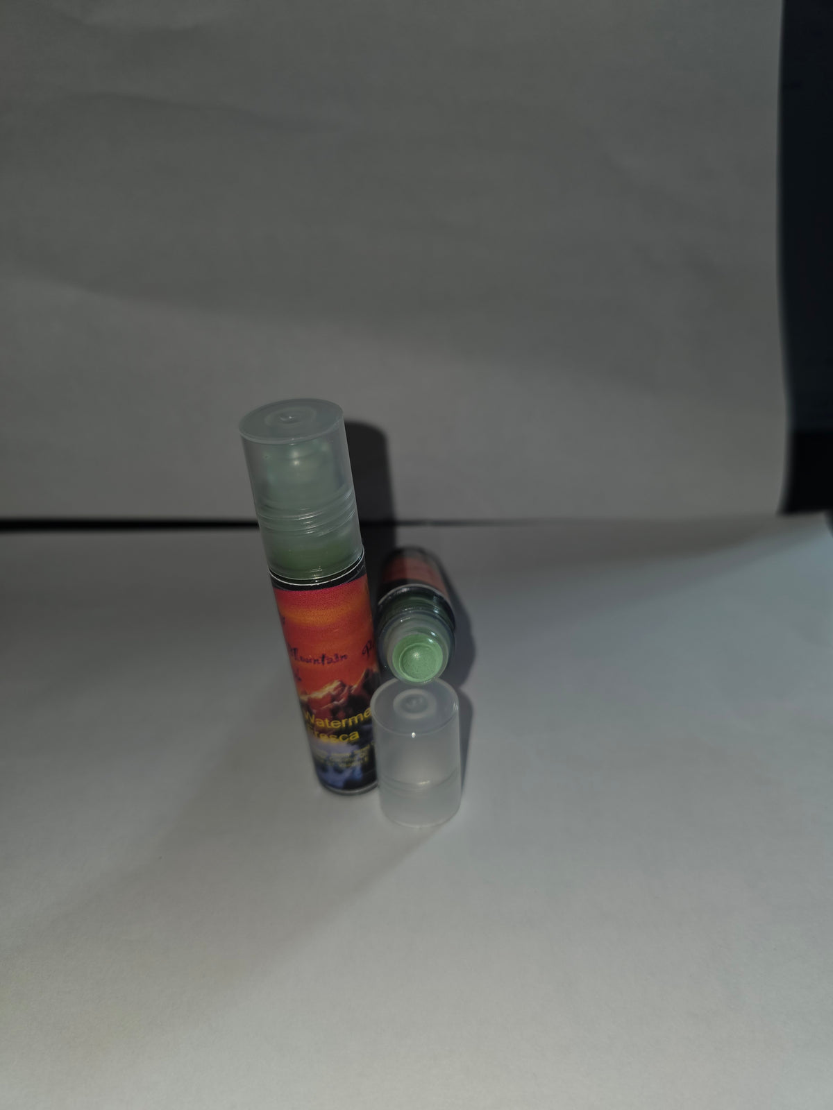 Watermelon Fresca Lip Gloss showing capped and open packaging